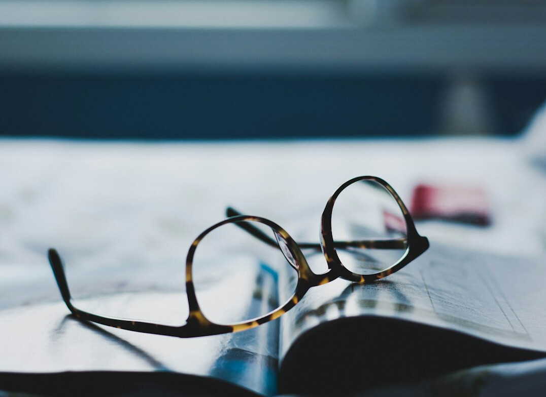open book with glasses