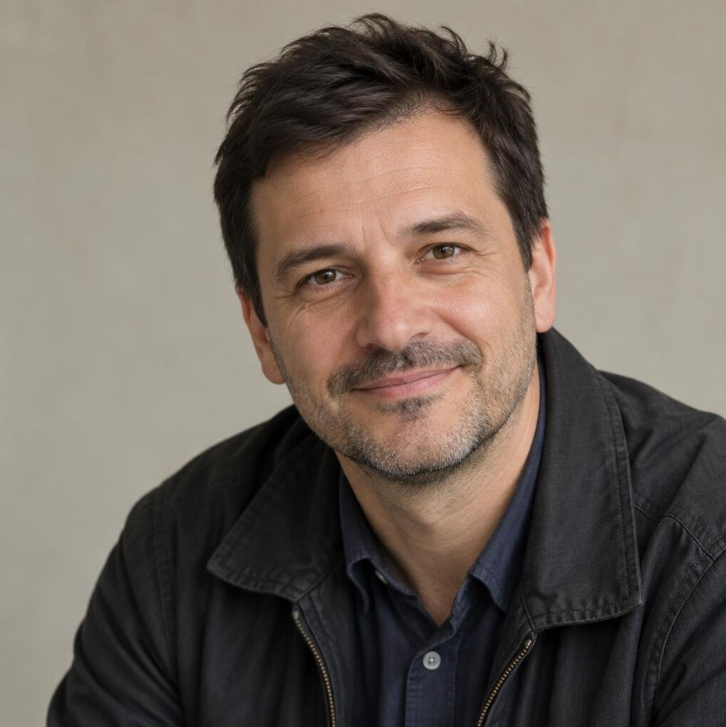 Studio portrait of a Croatian man in his forties, author, warm smile, casual jacket